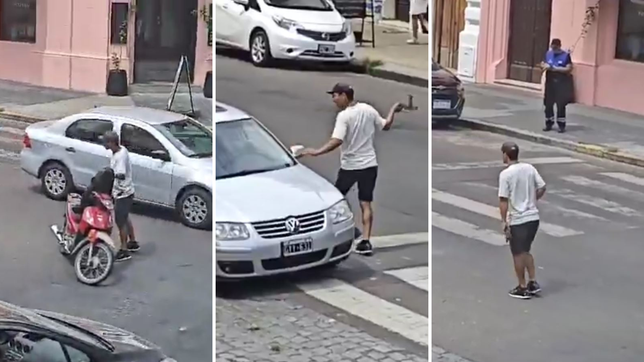 un motociclista amenazo con una cadena a un conductor frente a un inspector de transito