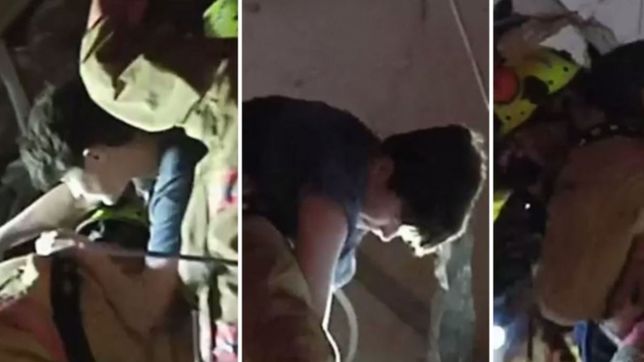 el momento en que un chico es rescatado de entre los escombros tras el derrumbe en miami