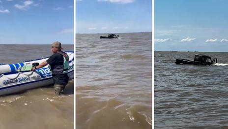Dos hombres se metieron al Río de la Plata con una camioneta, terminaron encajados y los tapó el agua Dos hombres se metieron al Río de la Plata con una camioneta, terminaron encajados y los tapó el agua
